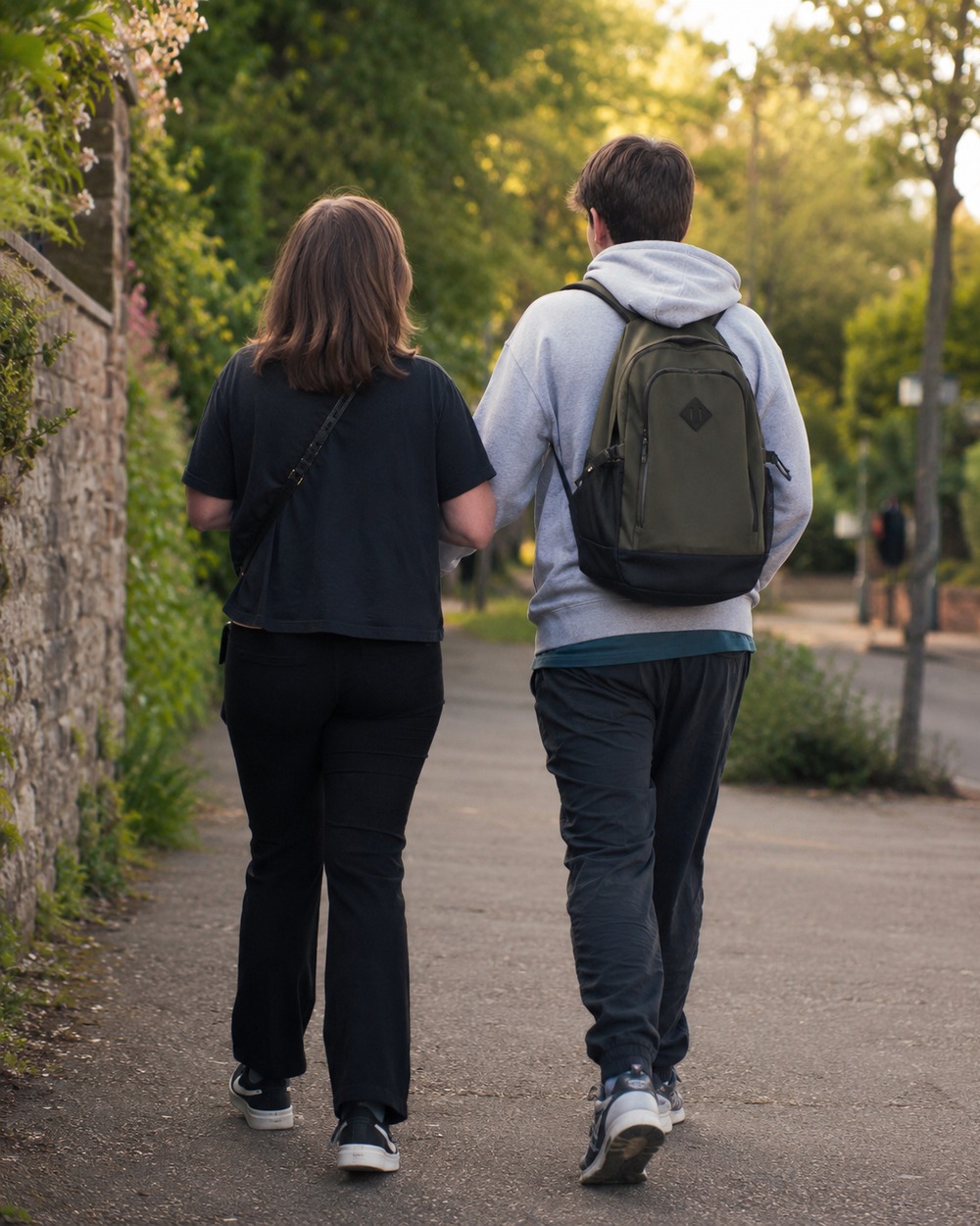 A Care Horizons support worker walking with a young adult they support